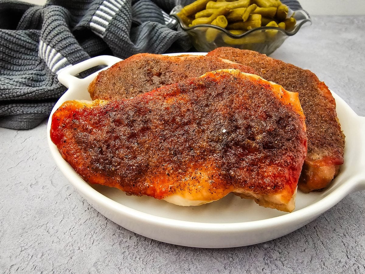 Juicy baked pork chops with brown sugar and ketchup glaze