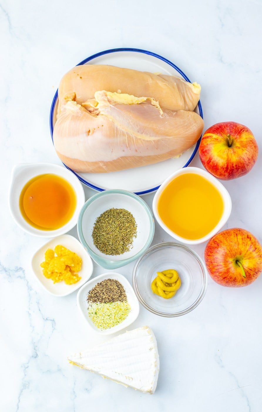 Ingredients for apple and brie stuffed chicken laid out on a counter
