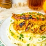 Apple and brie stuffed chicken breasts with maple glaze over mashed potatoes