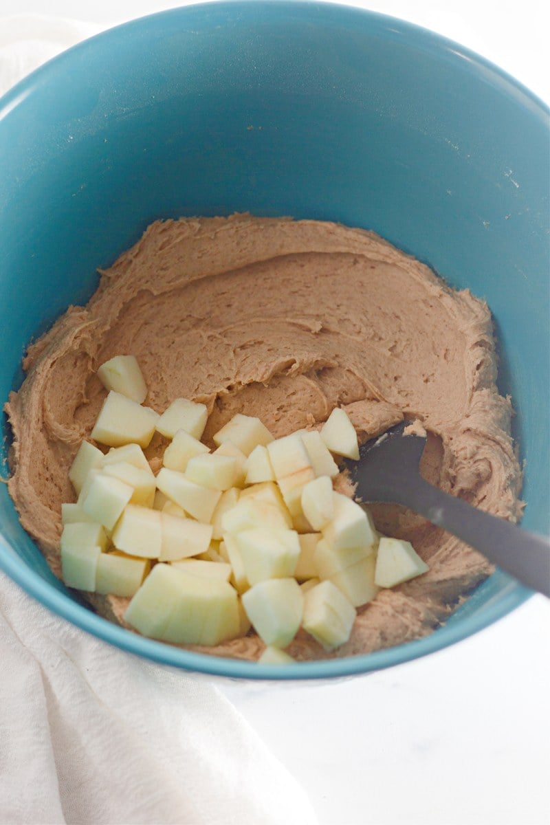 Apple cinnamon muffins folding in apples