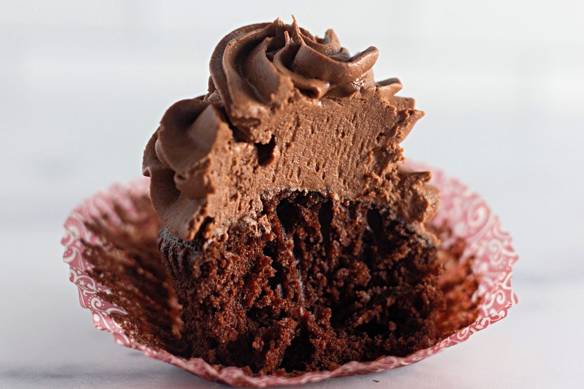 Cross-section of a chocolate cupcake showing the moist crumb