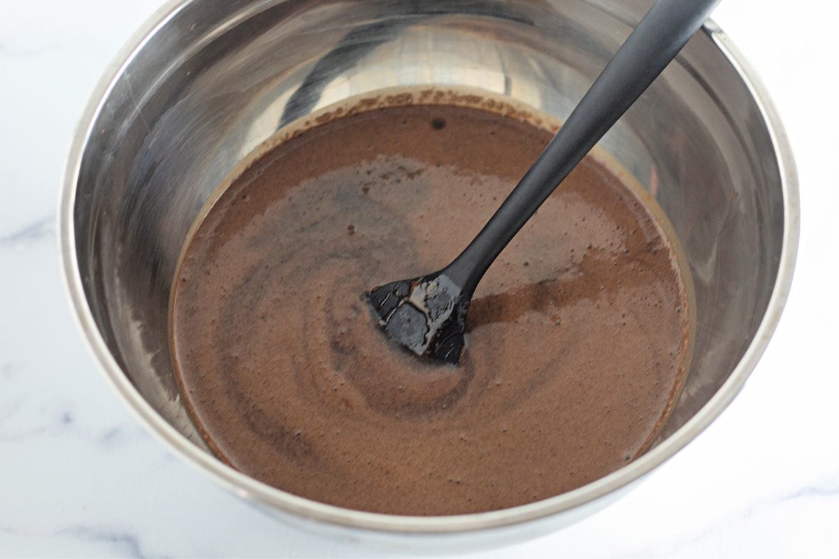 Smooth chocolate cupcake batter after adding cocoa and milk