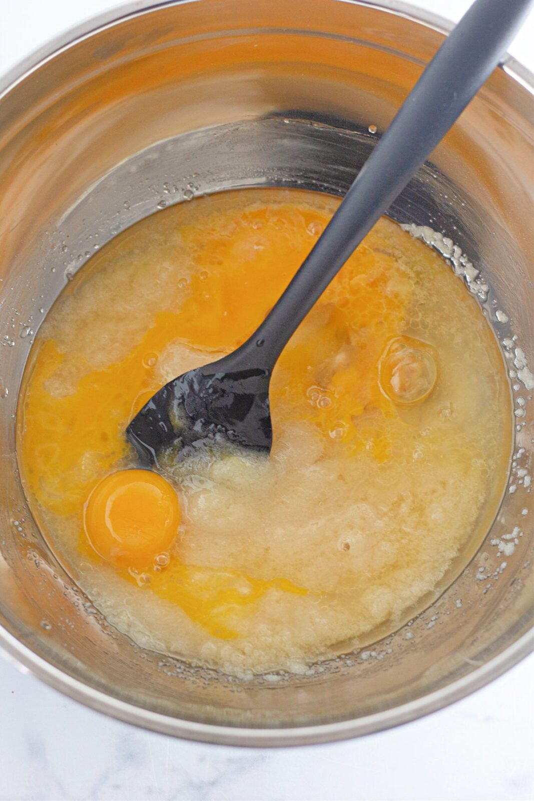 Eggs beaten into the wet cupcake batter base
