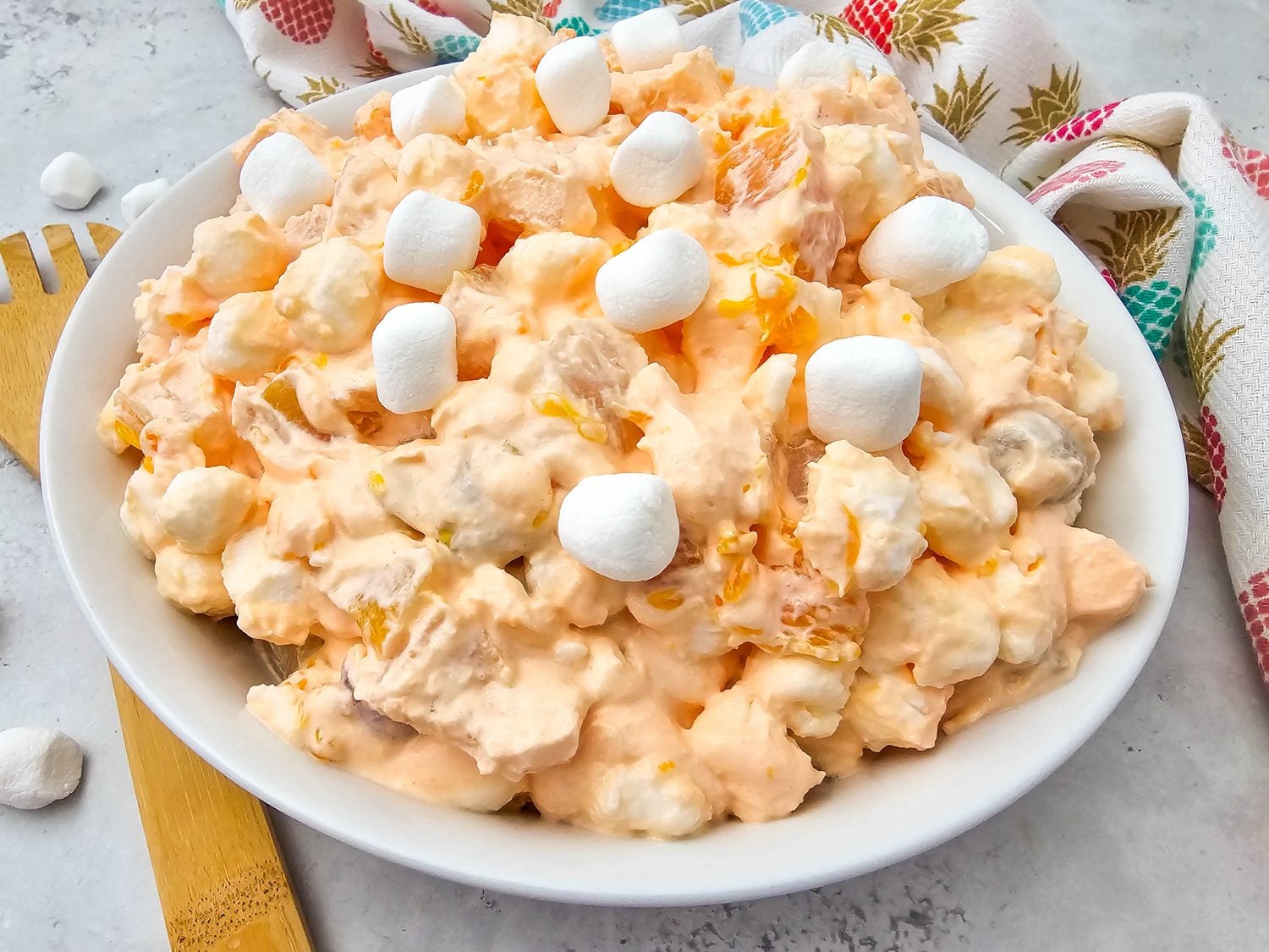 Creamy Hawaiian fruit salad with marshmallows in a white bowl