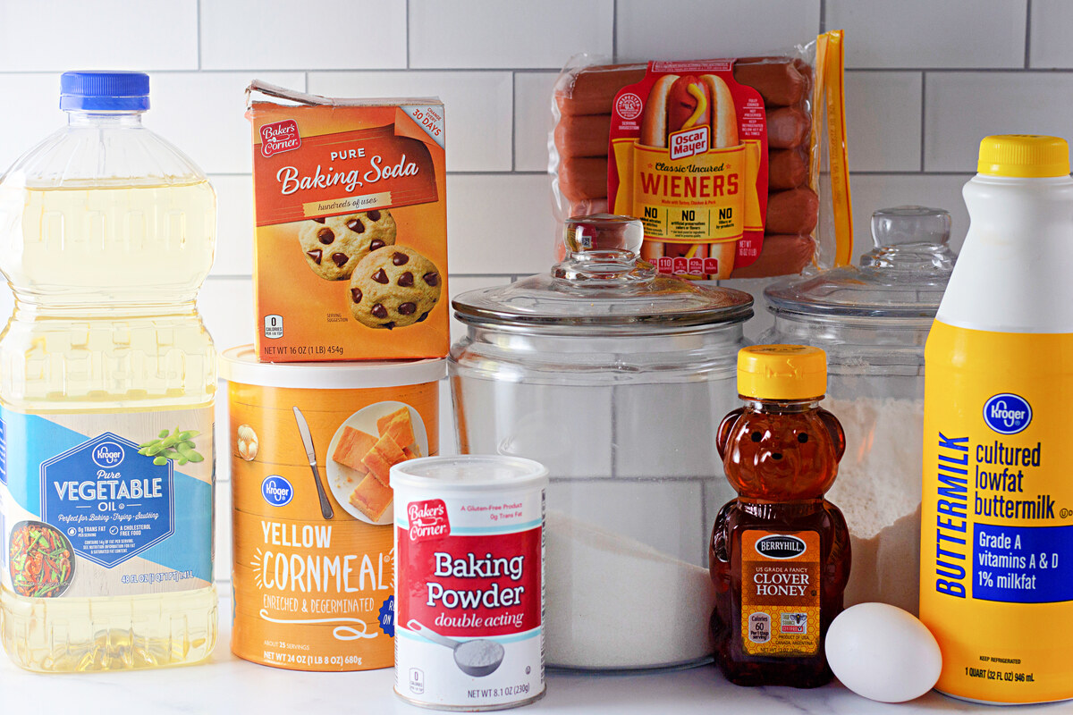 Ingredients for homemade corn dogs on a kitchen counter