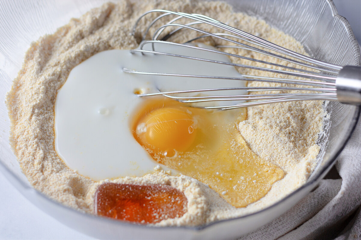 Egg and honey added to the corn dog batter bowl