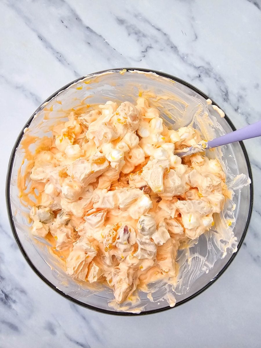 Hawaiian fruit salad stirred together until fully coated