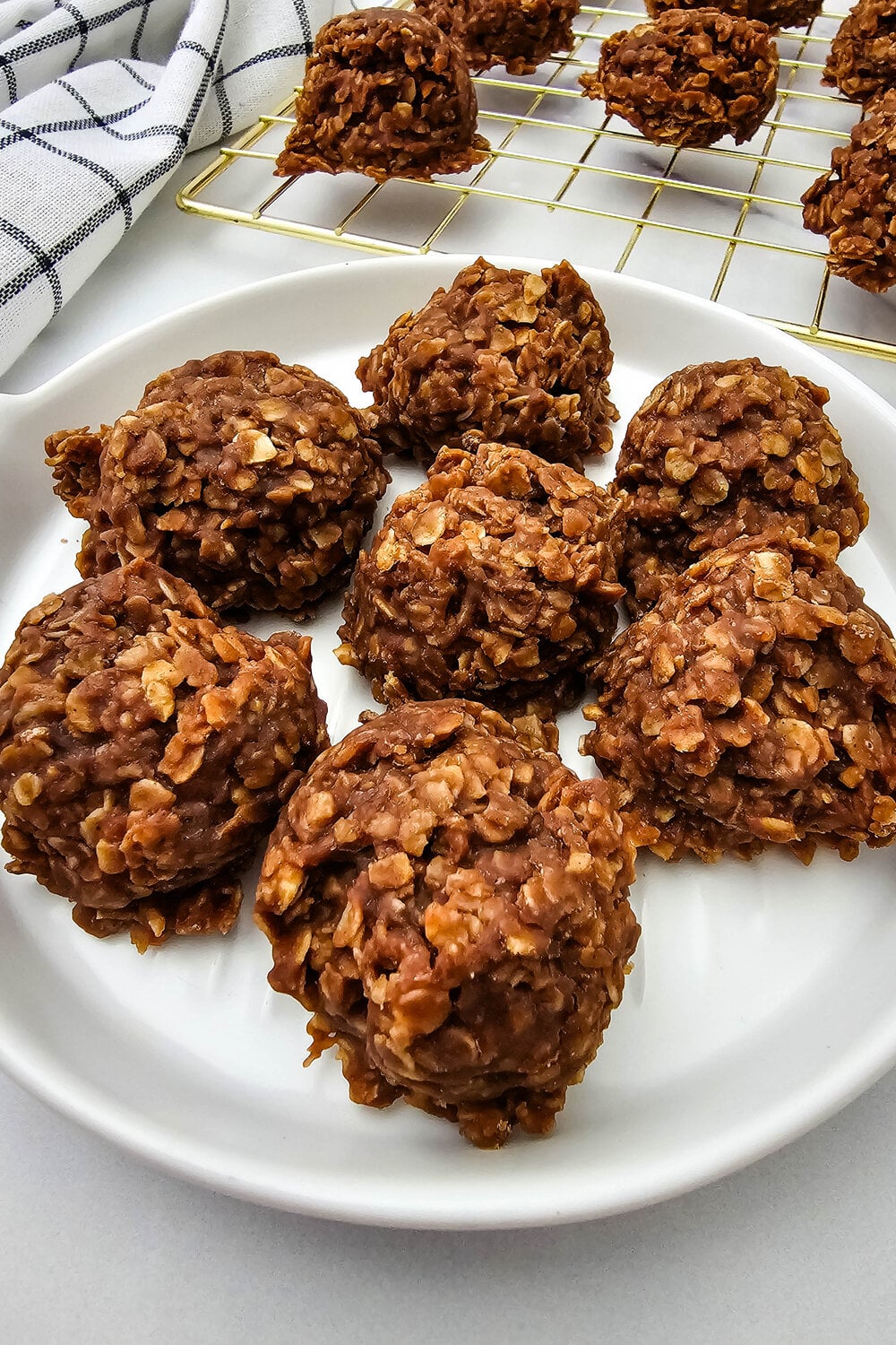 Close-up of chewy chocolate no-bake cookies showing oats and fudgy texture.
