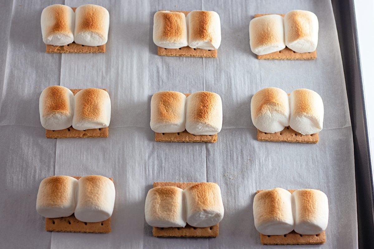 Golden toasted marshmallows on a baking sheet