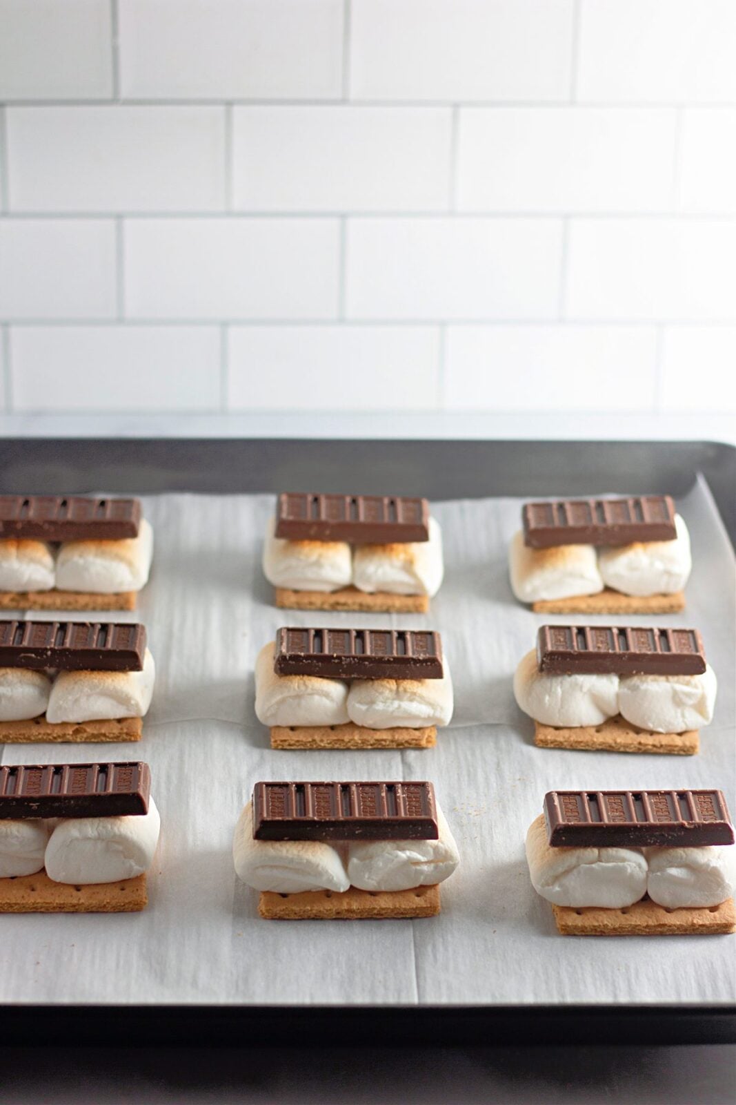 Hershey's chocolate bars placed on toasted marshmallows