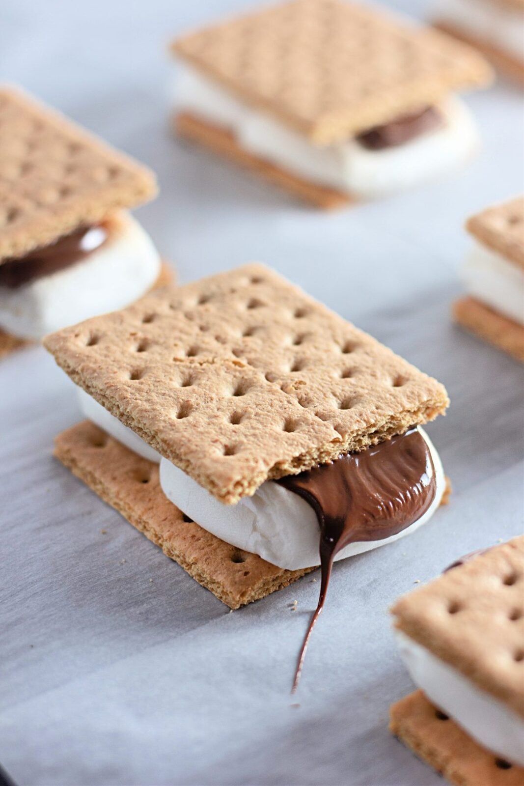 Close-up of an oven baked s'more with chocolate oozing out