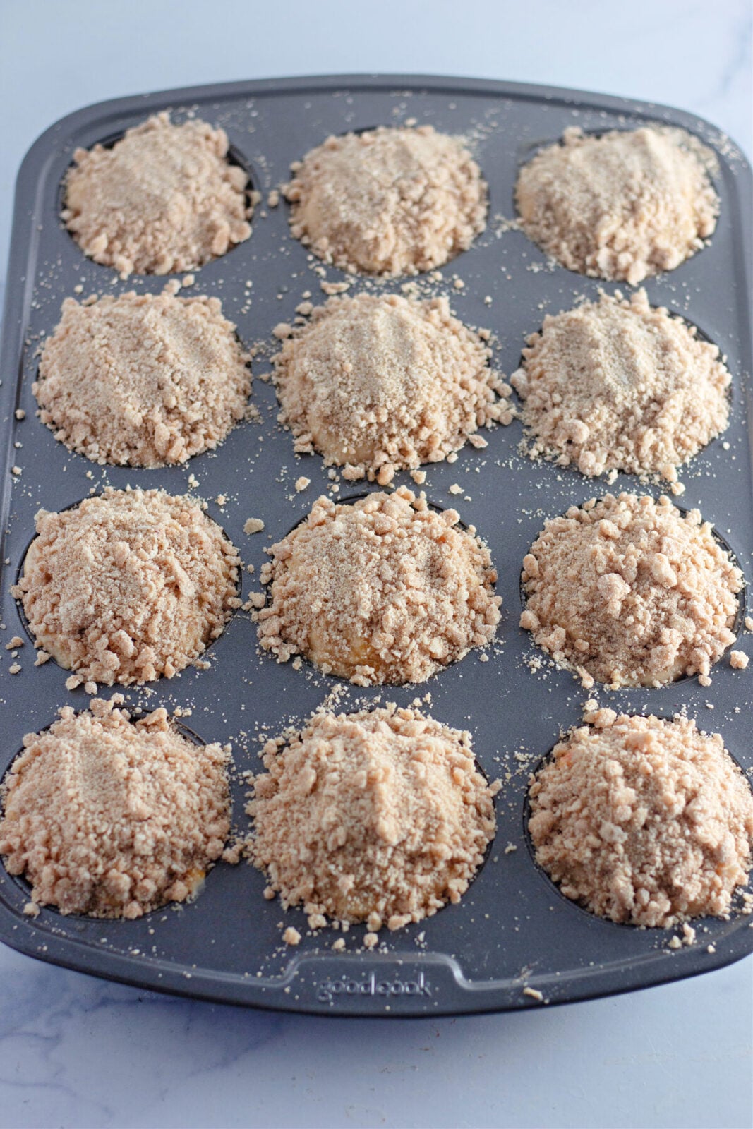 Peach streusel muffins add streusel topping