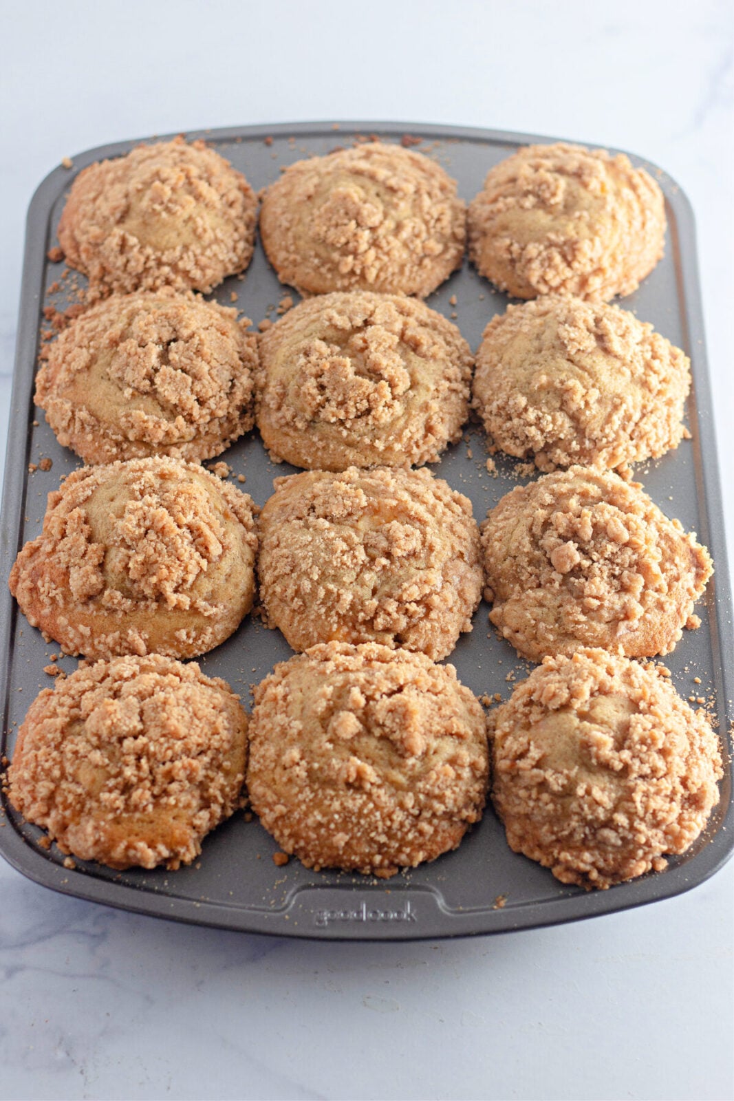 Peach streusel muffins baked
