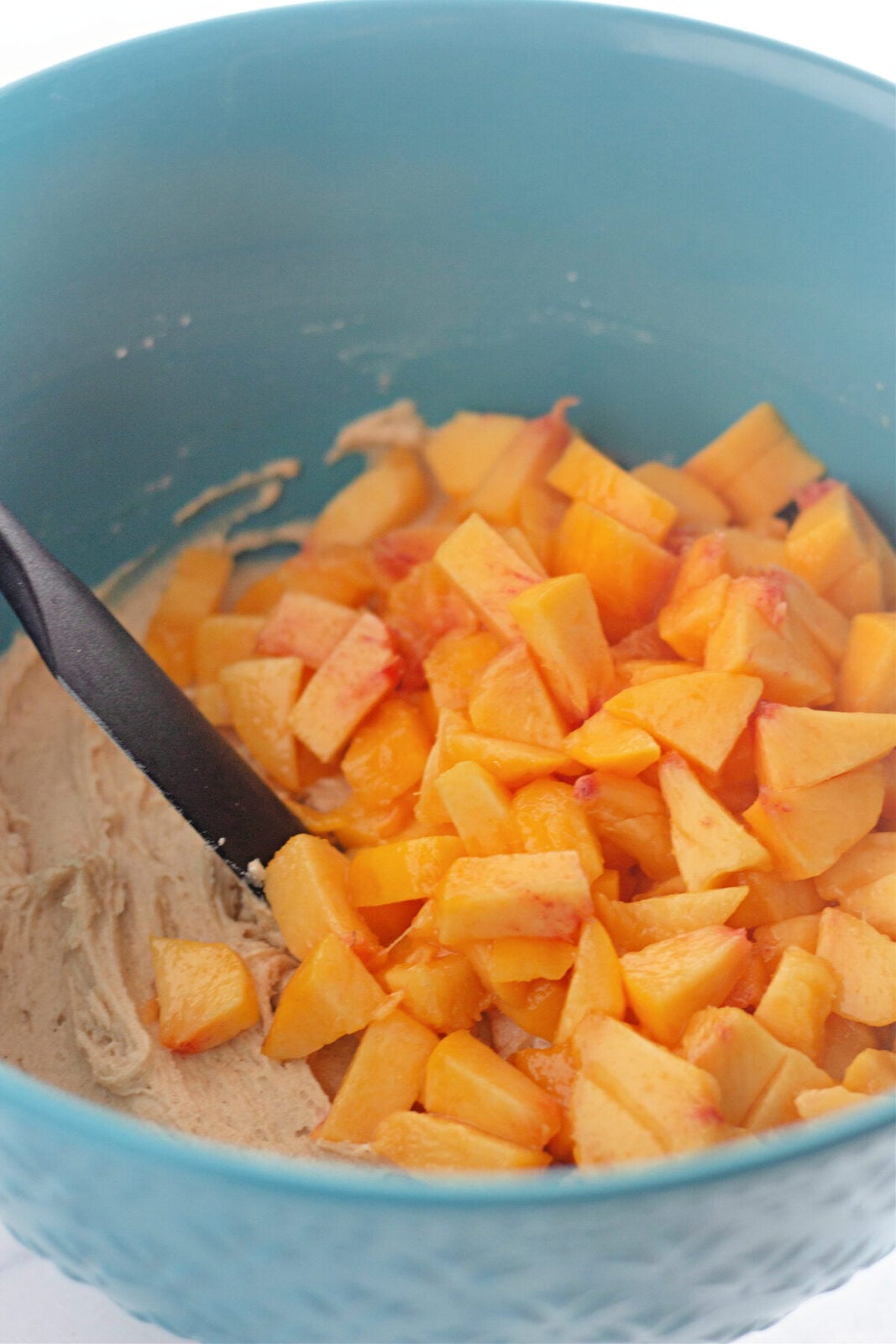 Peach streusel muffins fold peaches