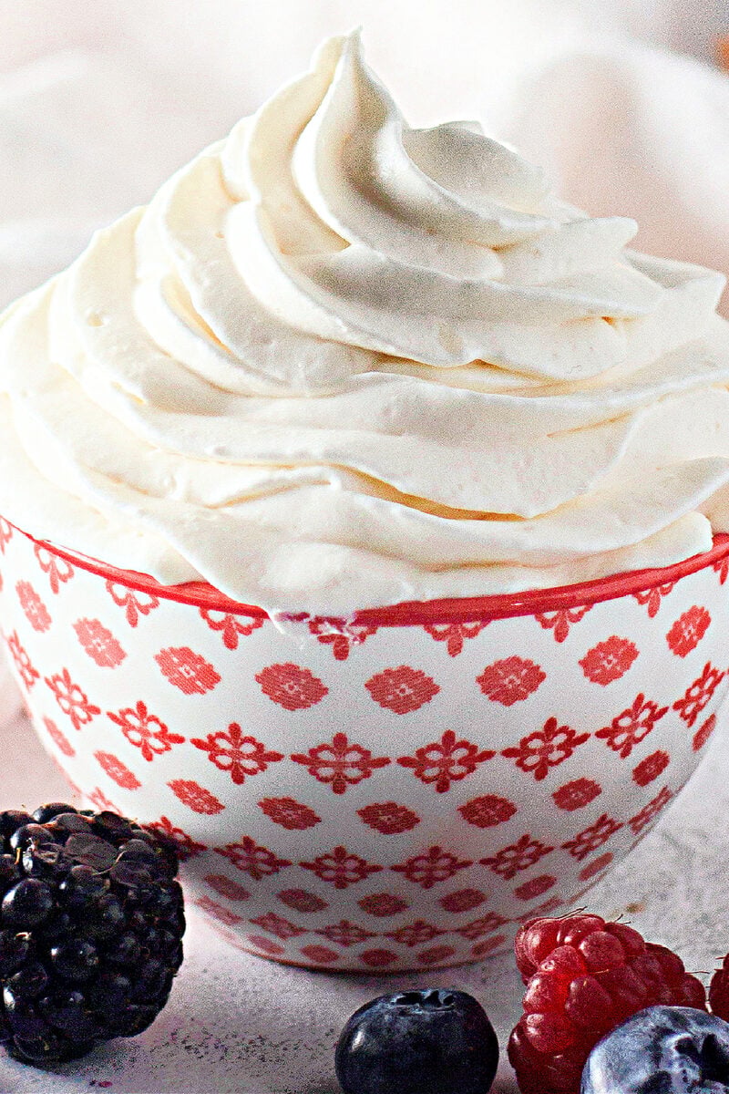 Piping stabilized whipped cream frosting into crisp swirls