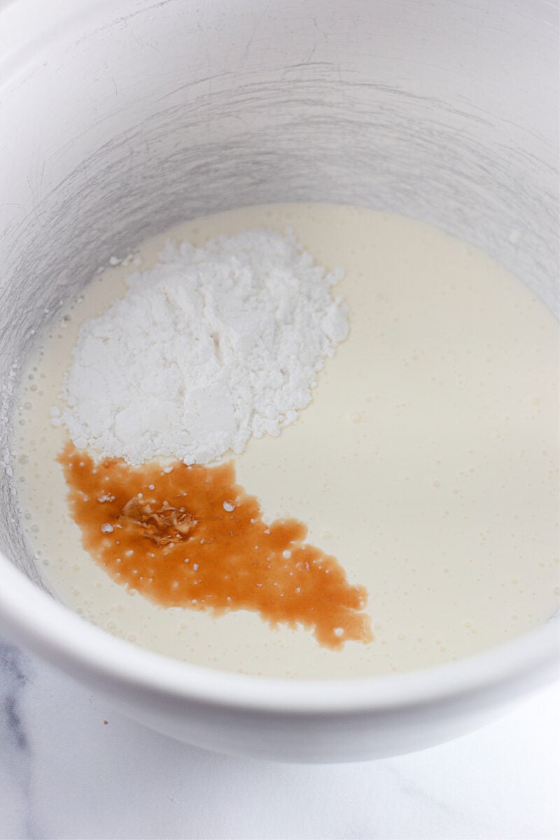 Drizzling melted gelatin into the whipped cream while beating