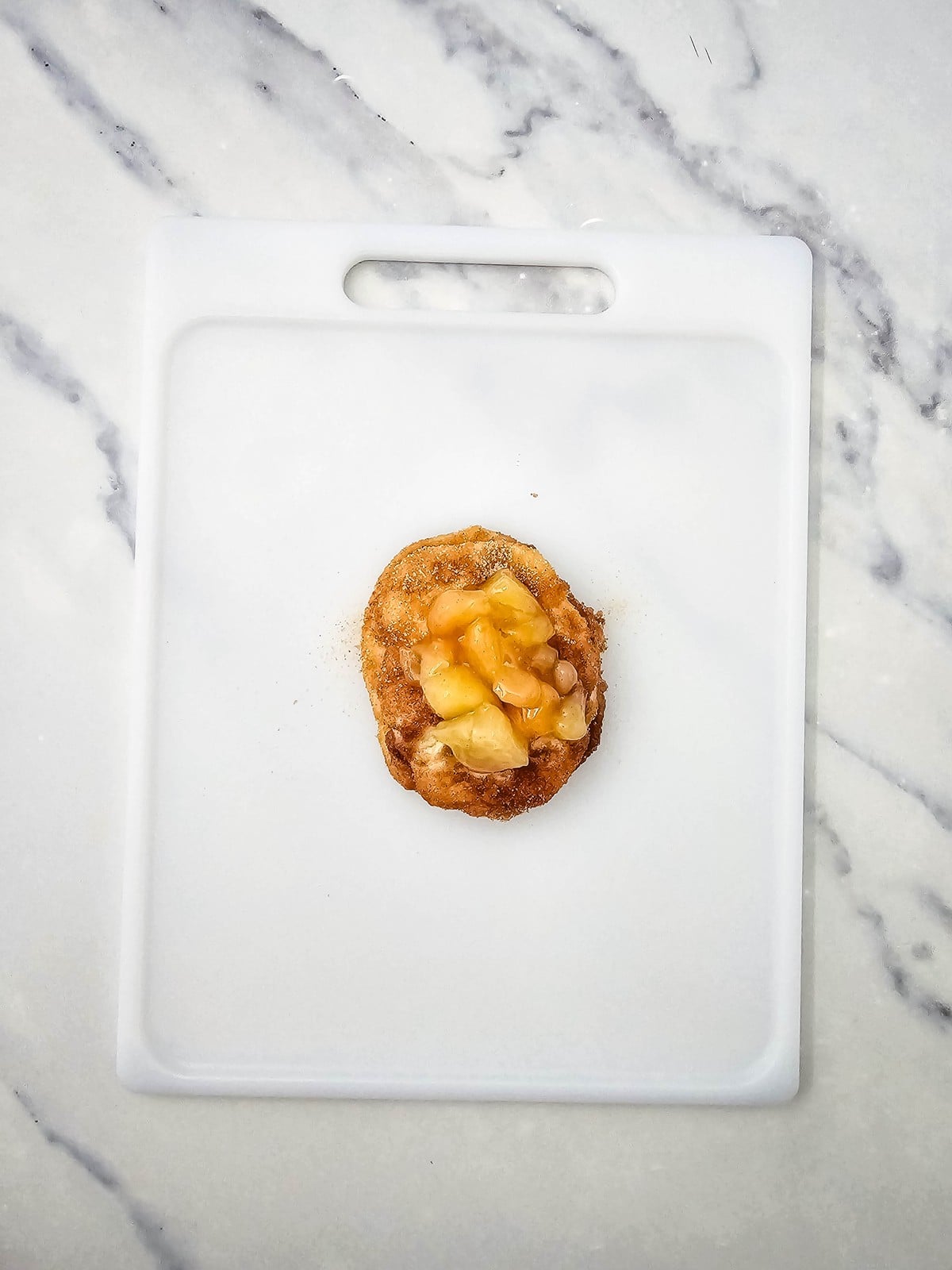 Cinnamon sugar biscuit stack layered with chopped apple pie filling