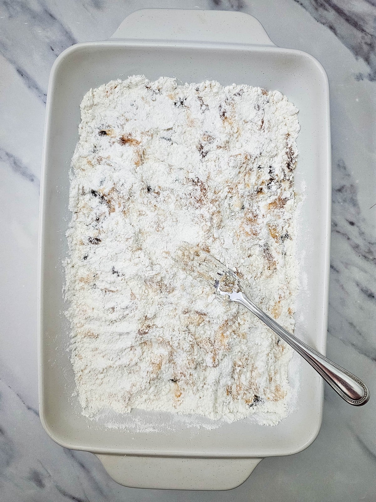 Dry butter cake mix spread over the apple filling