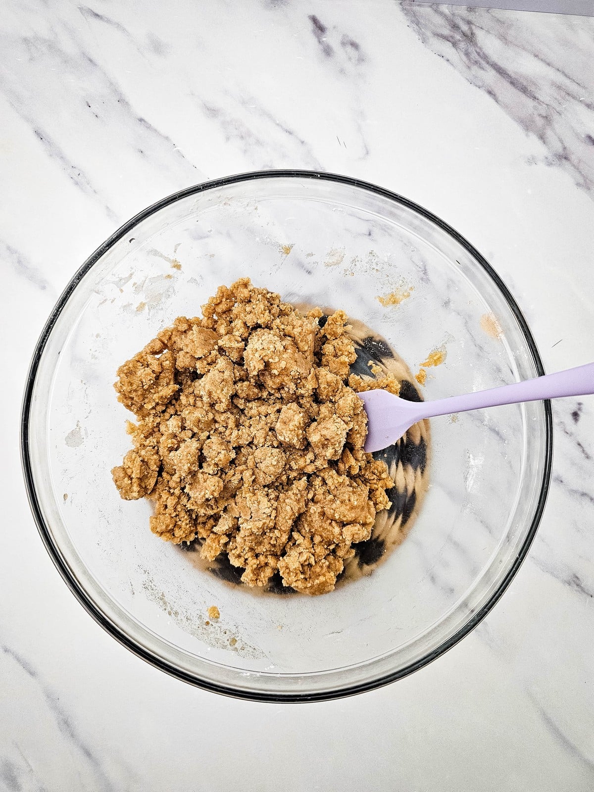 Crumble topping stirred into buttery clumps