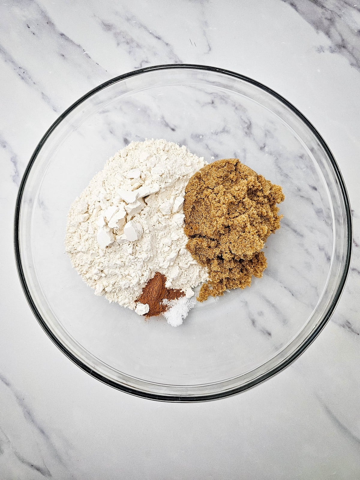 Flour, brown sugar and cinnamon in a bowl for the crumble topping