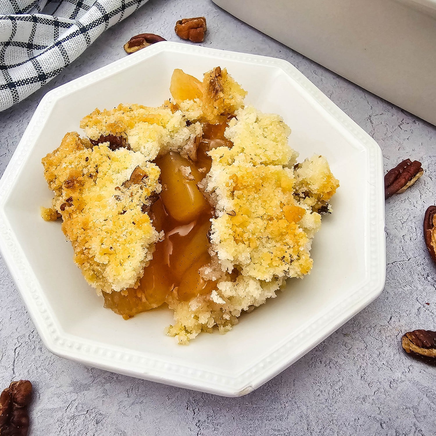 Apple crisp made with apple pie filling and a golden pecan crumble topping