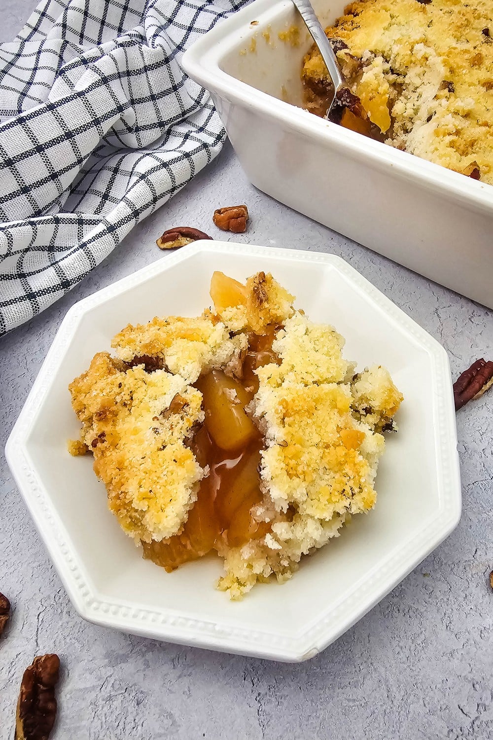 Easy apple crisp with apple pie filling topped with a pecan crumble