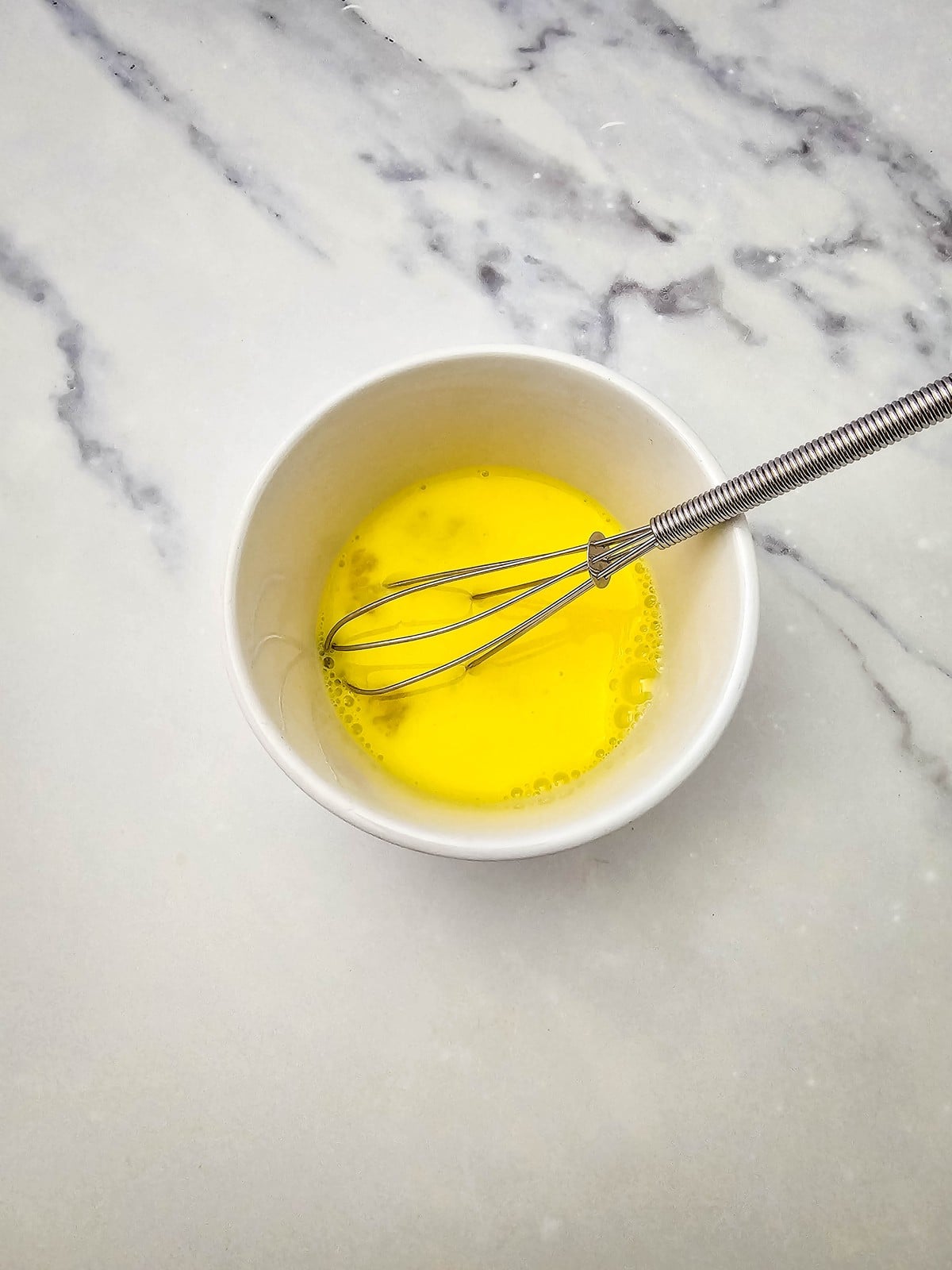 Egg and water whisked together for egg wash