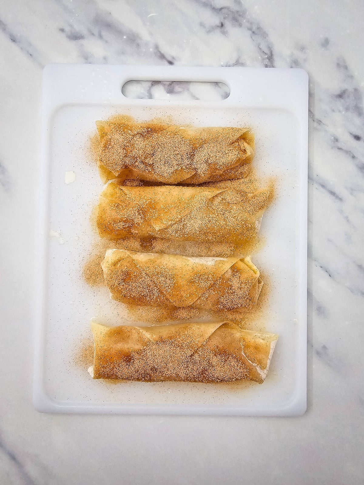 Apple pie egg rolls coated in cinnamon sugar