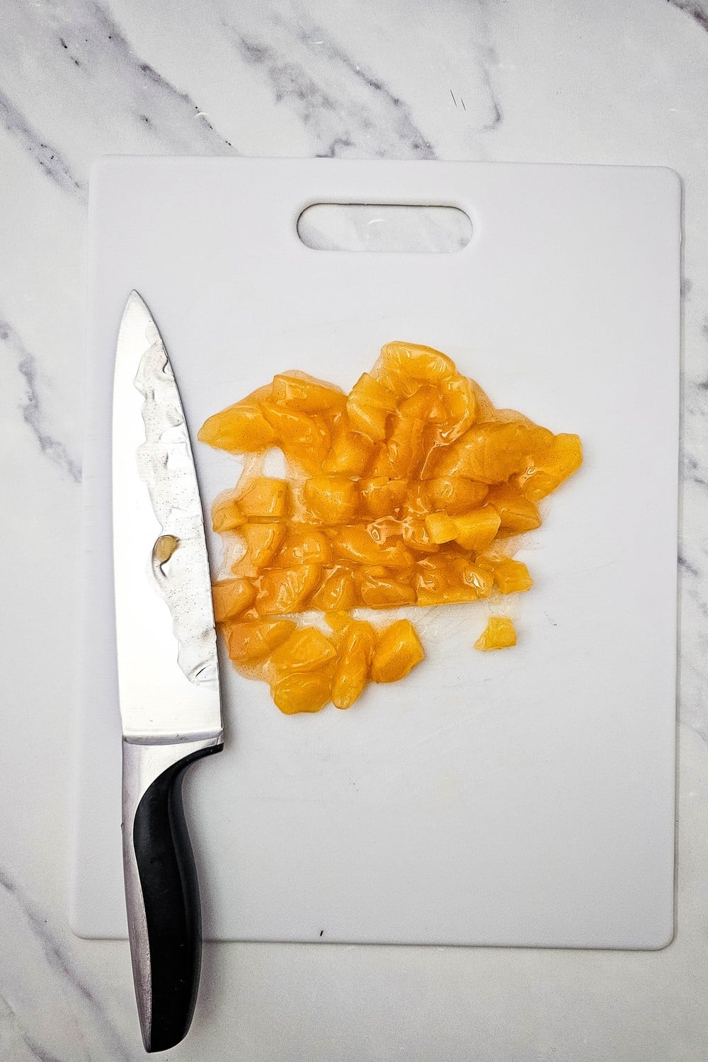 Chopped apple pie filling on a cutting board