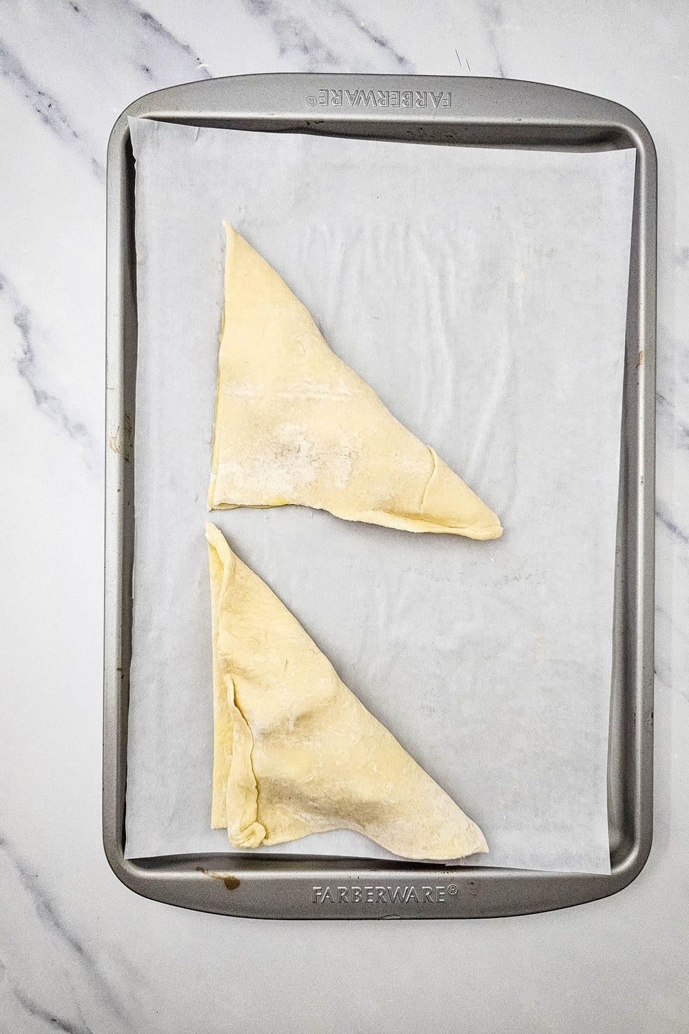 Puff pastry folded into triangles over apple filling