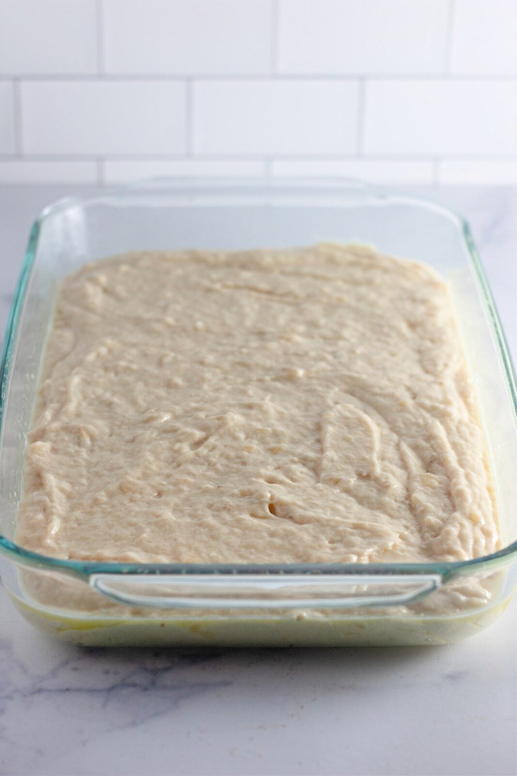 Baked banana coffee cake cooling in the glass baking pan