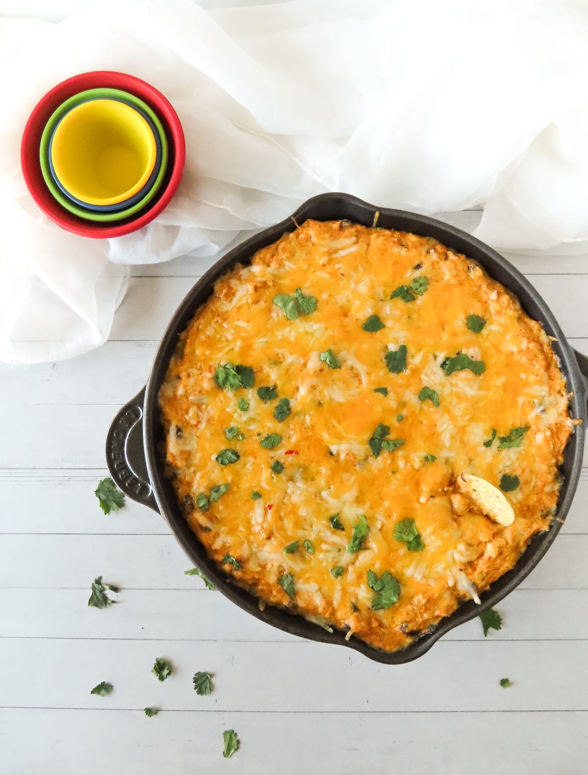 Chicken enchilada dip garnished with fresh cilantro
