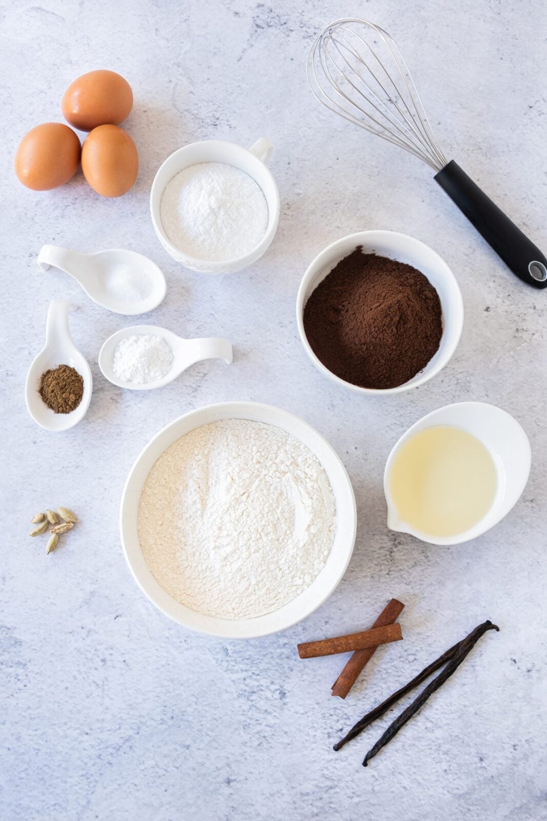 Chocolate snowball cookies ingredients: cocoa, flour, powdered sugar, eggs, oil, and spices