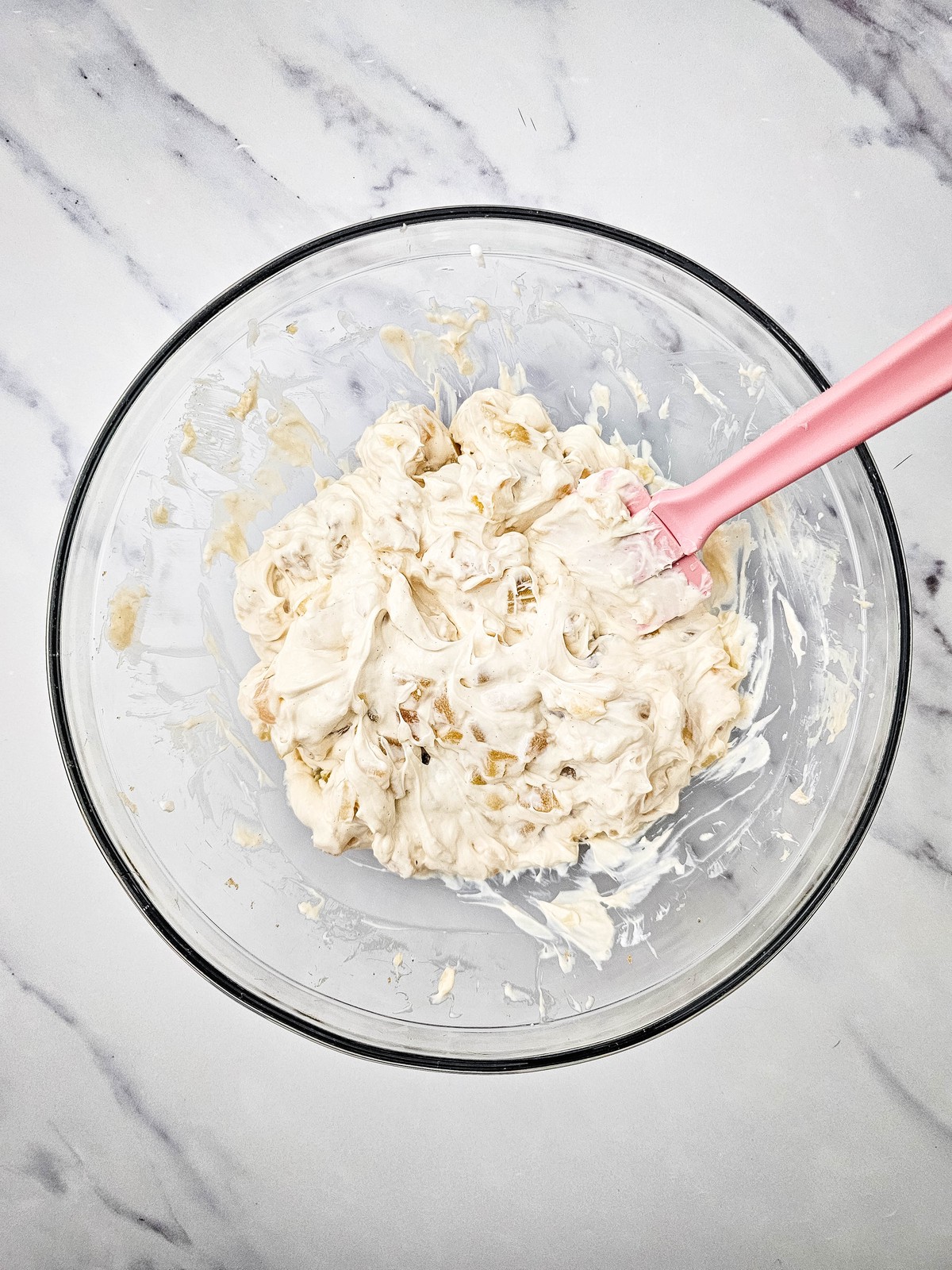 Chopped apple pie filling folded into the creamy dip with a spatula