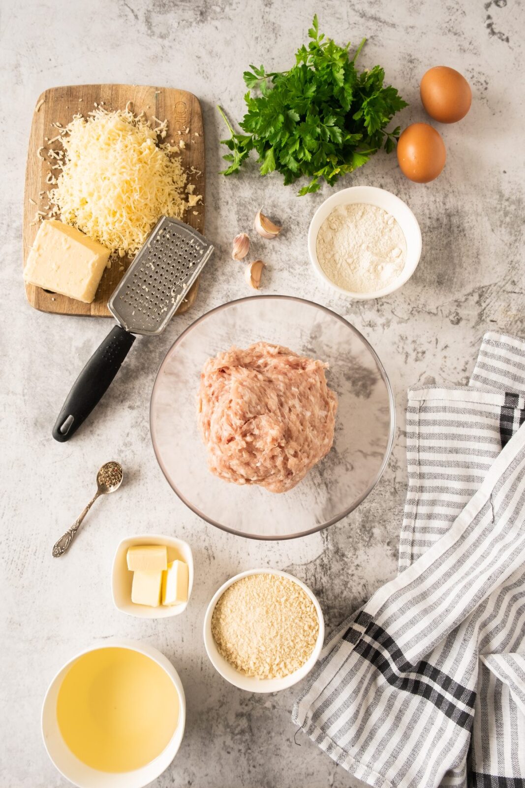 Garlic butter chicken balls ingredients: ground chicken, butter, garlic, pecorino, parsley, flour, eggs, and panko