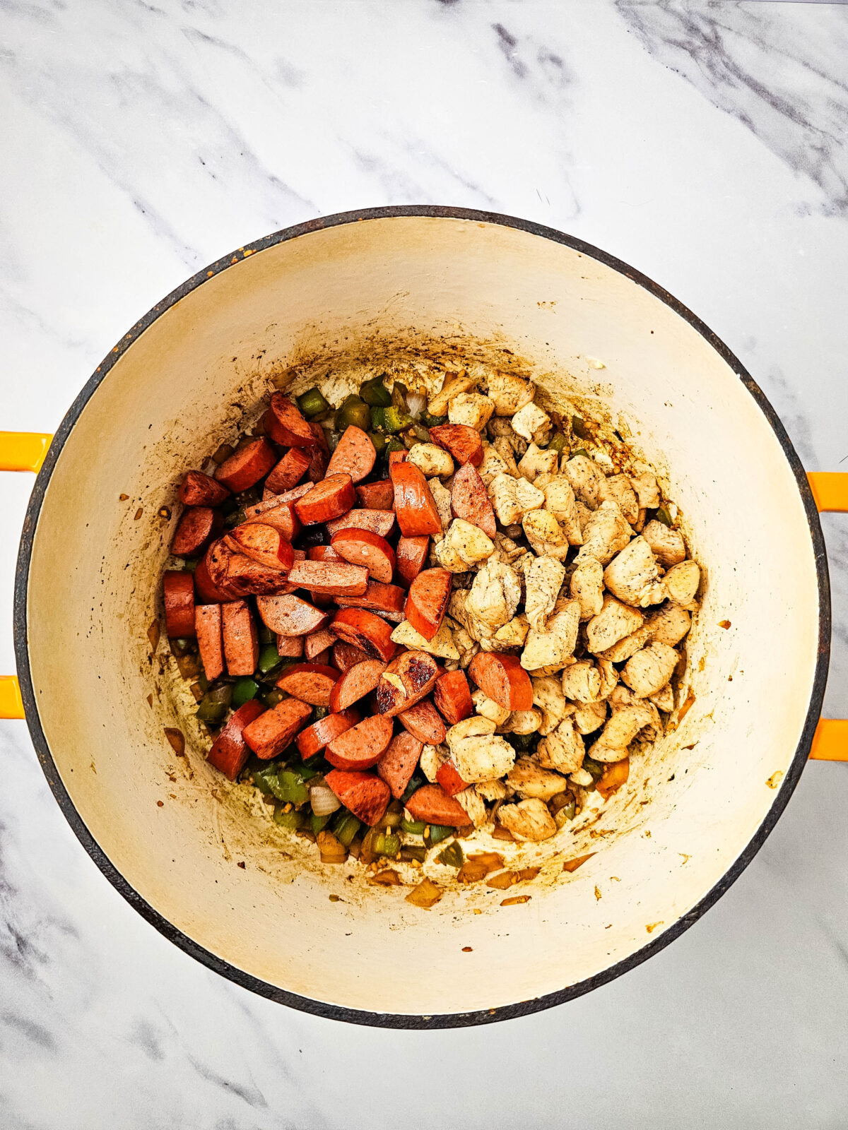 Sausage and chicken added back to the pot with vegetables