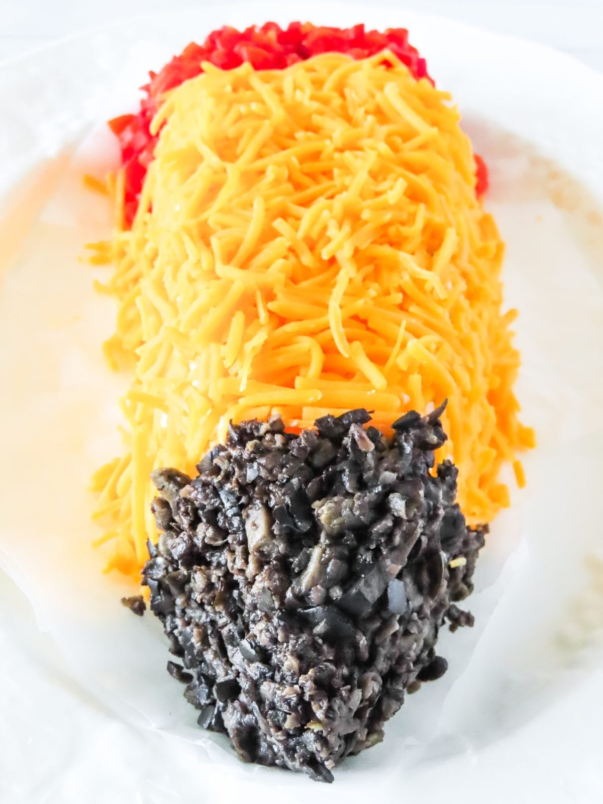 Pressing chopped black olives onto the pencil tip