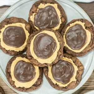 Plate of buckeye brownie cookies topped with peanut butter and chocolate ganache