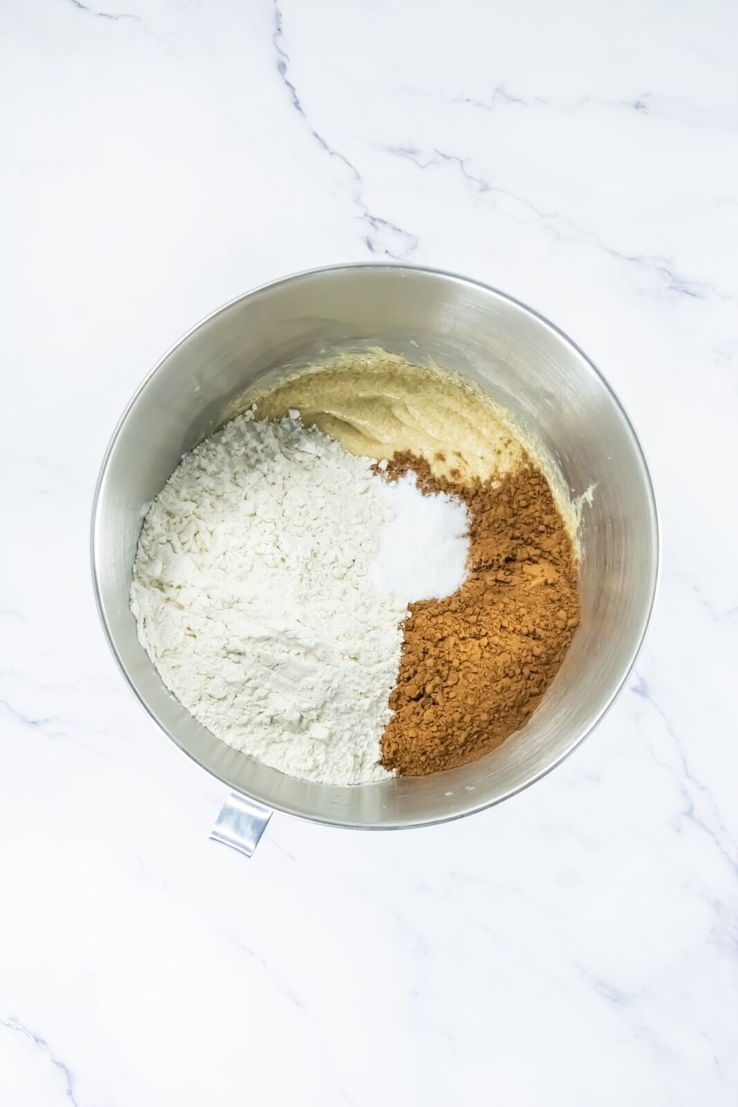 Flour, cocoa powder, baking soda, and salt added to the cookie dough
