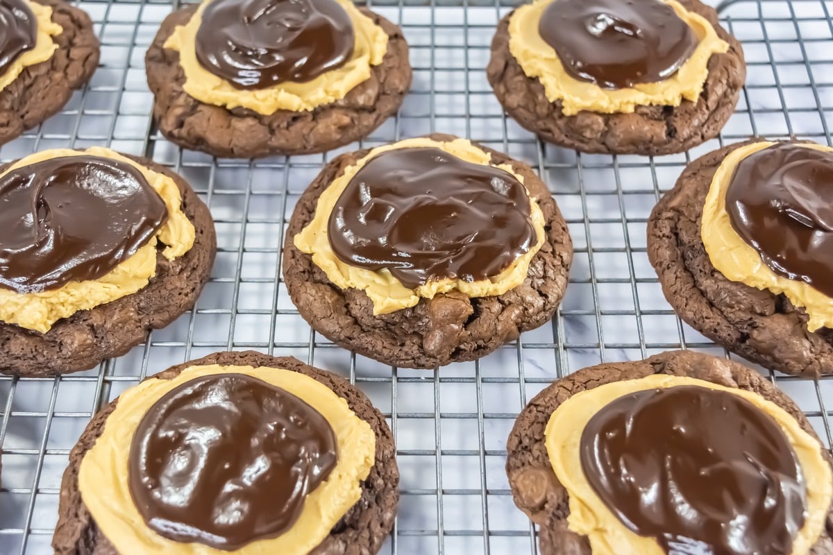 Closeup of finished buckeye brownie cookies on a wire rack