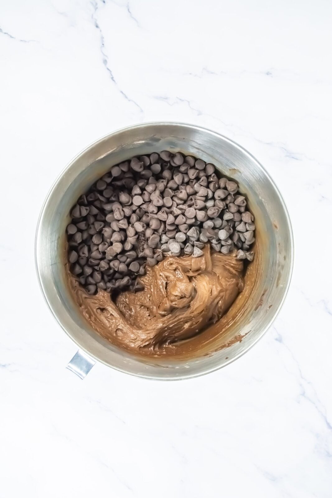 Folding chocolate chips into the brownie cookie dough