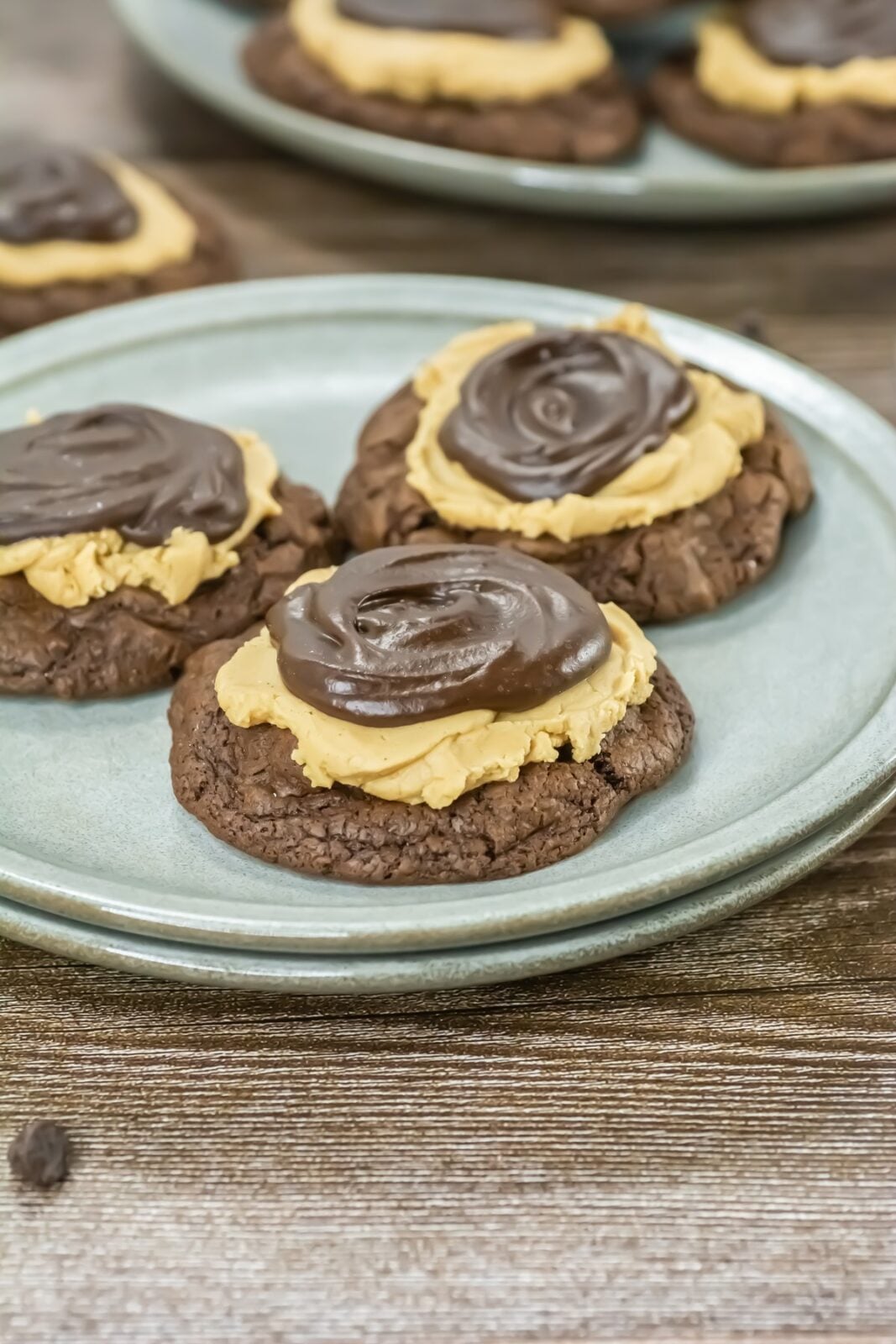 Buckeye brownie cookies on a plate with bottles of milk