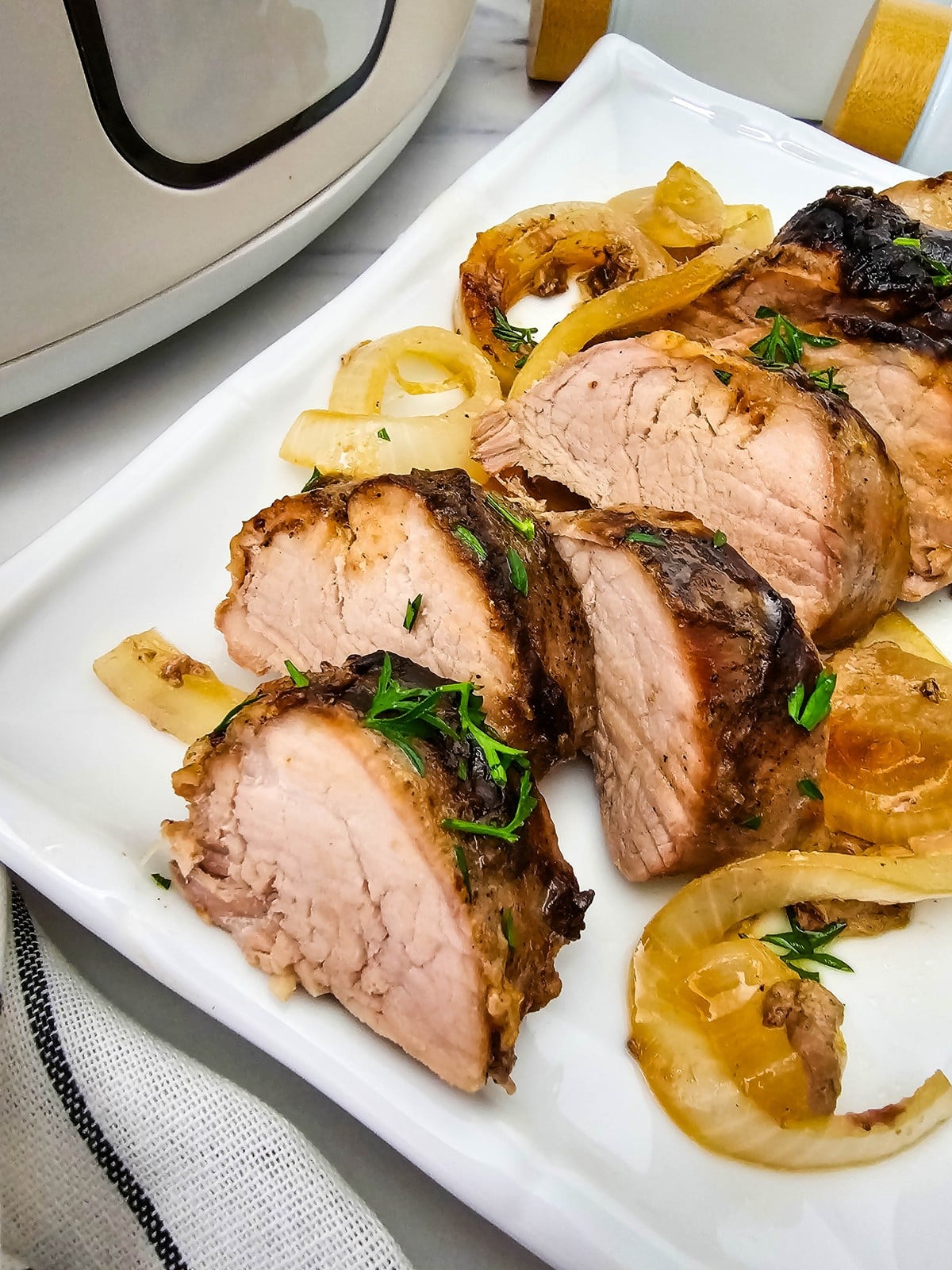 Crockpot Pork Tenderloin sliced and plated