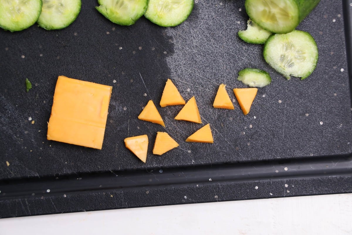 Cheddar cheese block cut into small triangles for owl cracker beaks