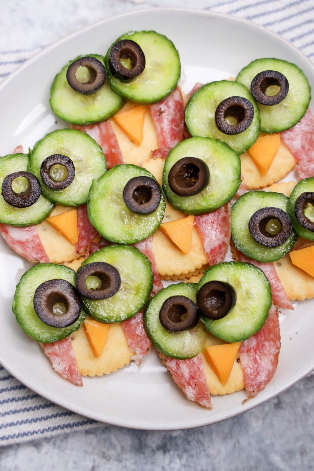 Finished owl snacks plated on a white dish for a fall party
