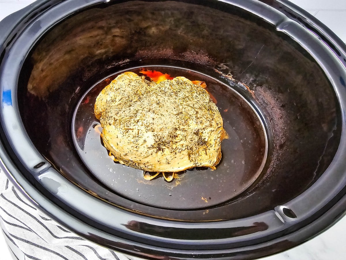 Cooked herb crusted turkey breast in the slow cooker