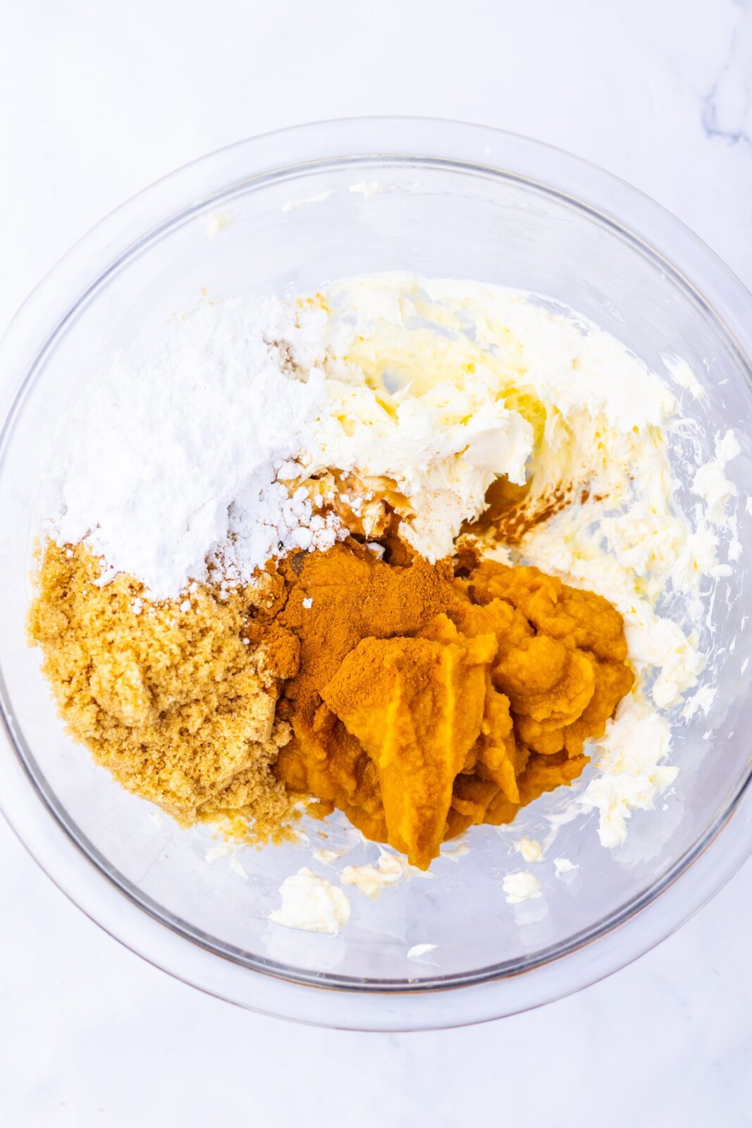 Pumpkin Spice Cookie Dough Dip process: add the pumpkin puree, brown sugar, powdered sugar, vanilla, pumpkin pie spice, cinnamon, and salt and mix until fully